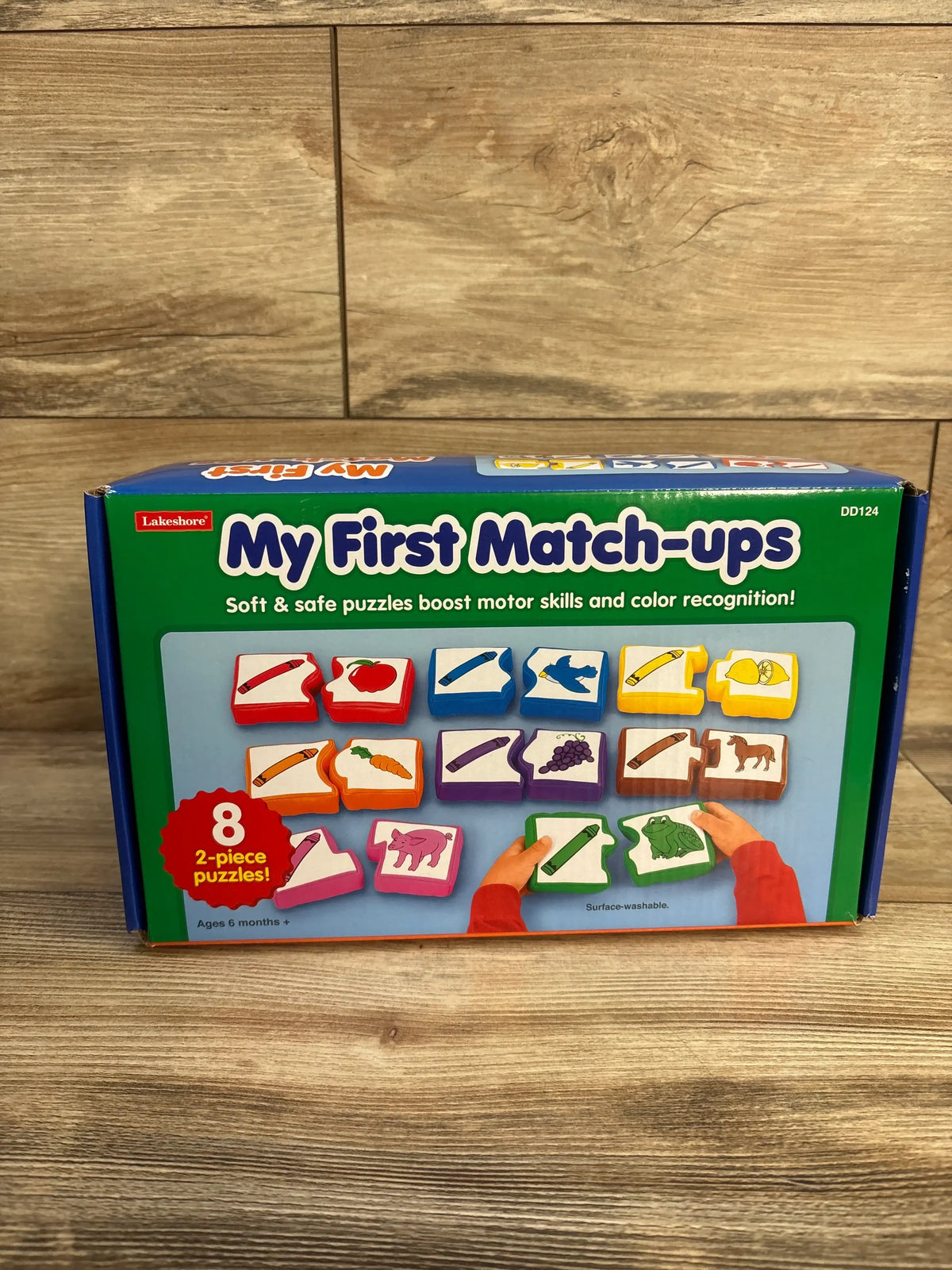 Front view of Lakeshore My First Match-Ups box showcasing 8 two-piece color-matching puzzles on a wood surface