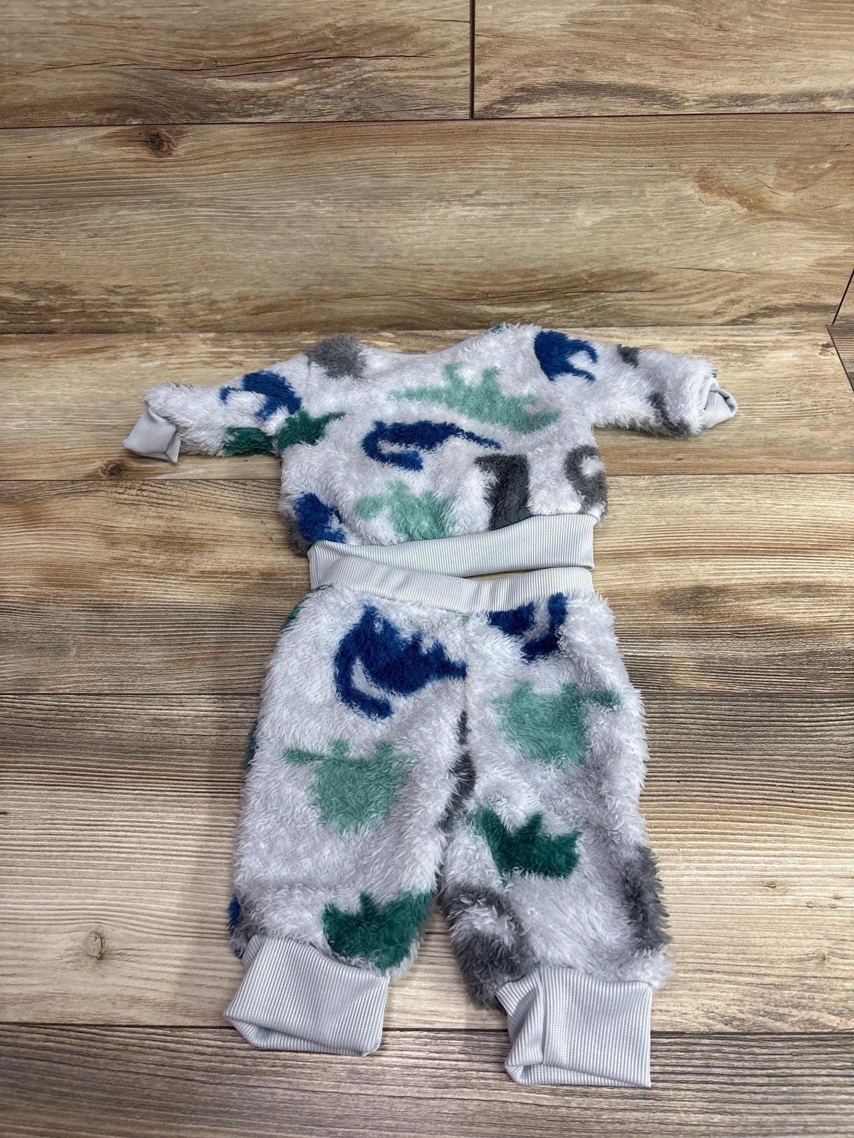 Grey plush 2-piece dinosaur print sweatshirt and joggers set for infants size 0-3m.