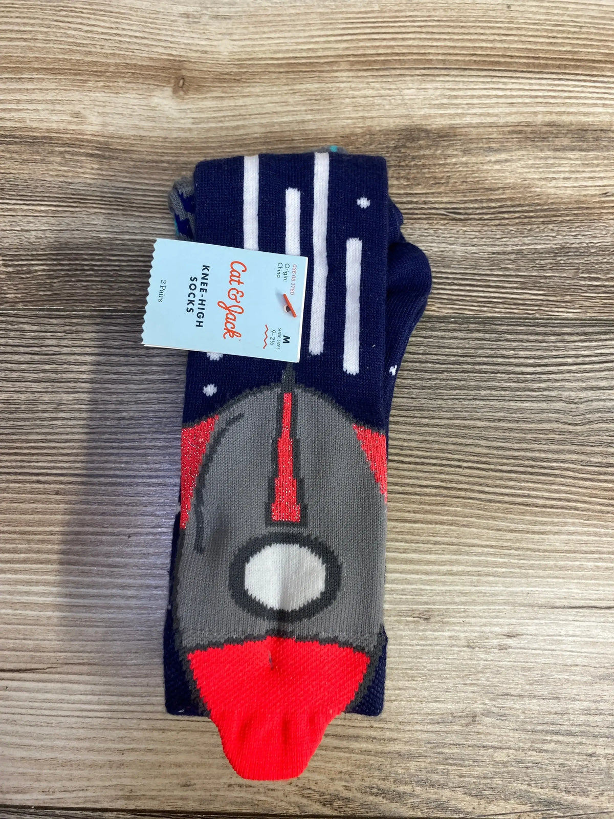 Cat & Jack knee-high socks with spaceship and star pattern, navy blue and red colors