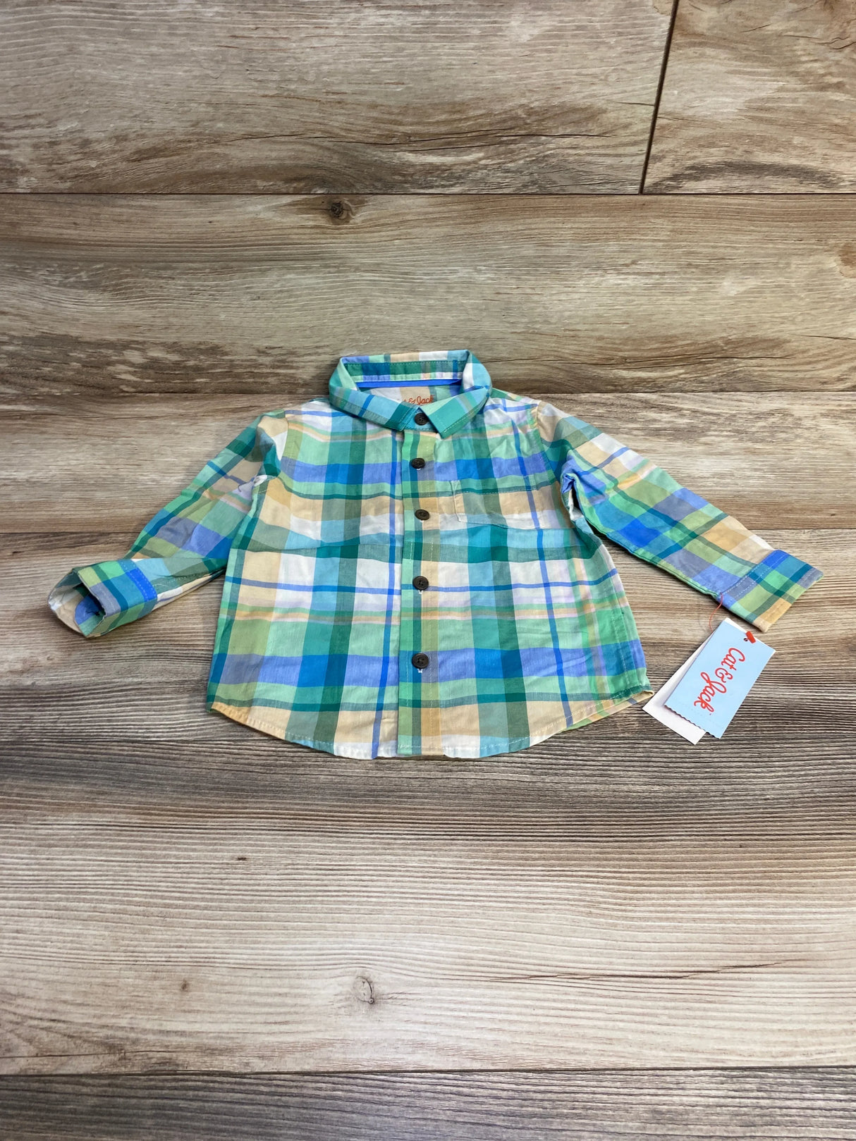 Front flat-lay of Cat and Jack plaid button-up shirt 18M with green and blue checks, chest pocket and brown buttons