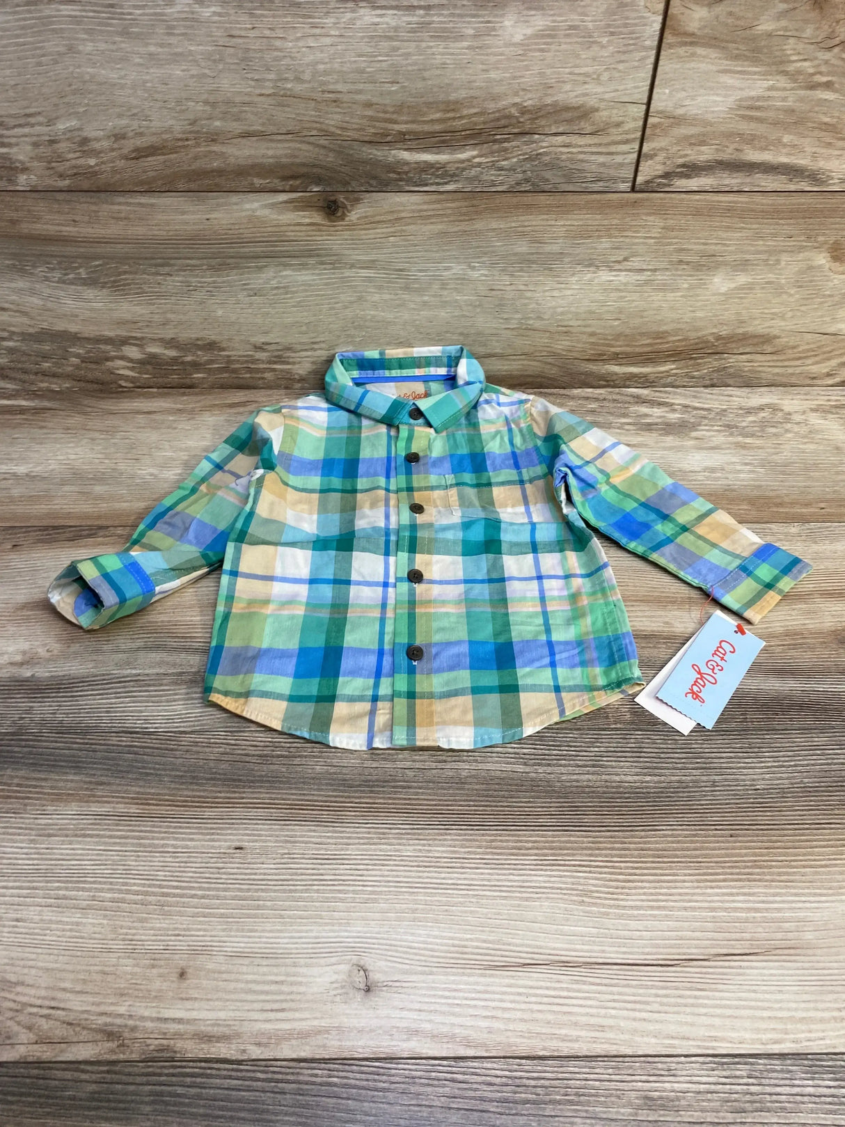 Front flat-lay of Cat and Jack plaid button-up shirt 18M with green and blue checks, chest pocket and brown buttons