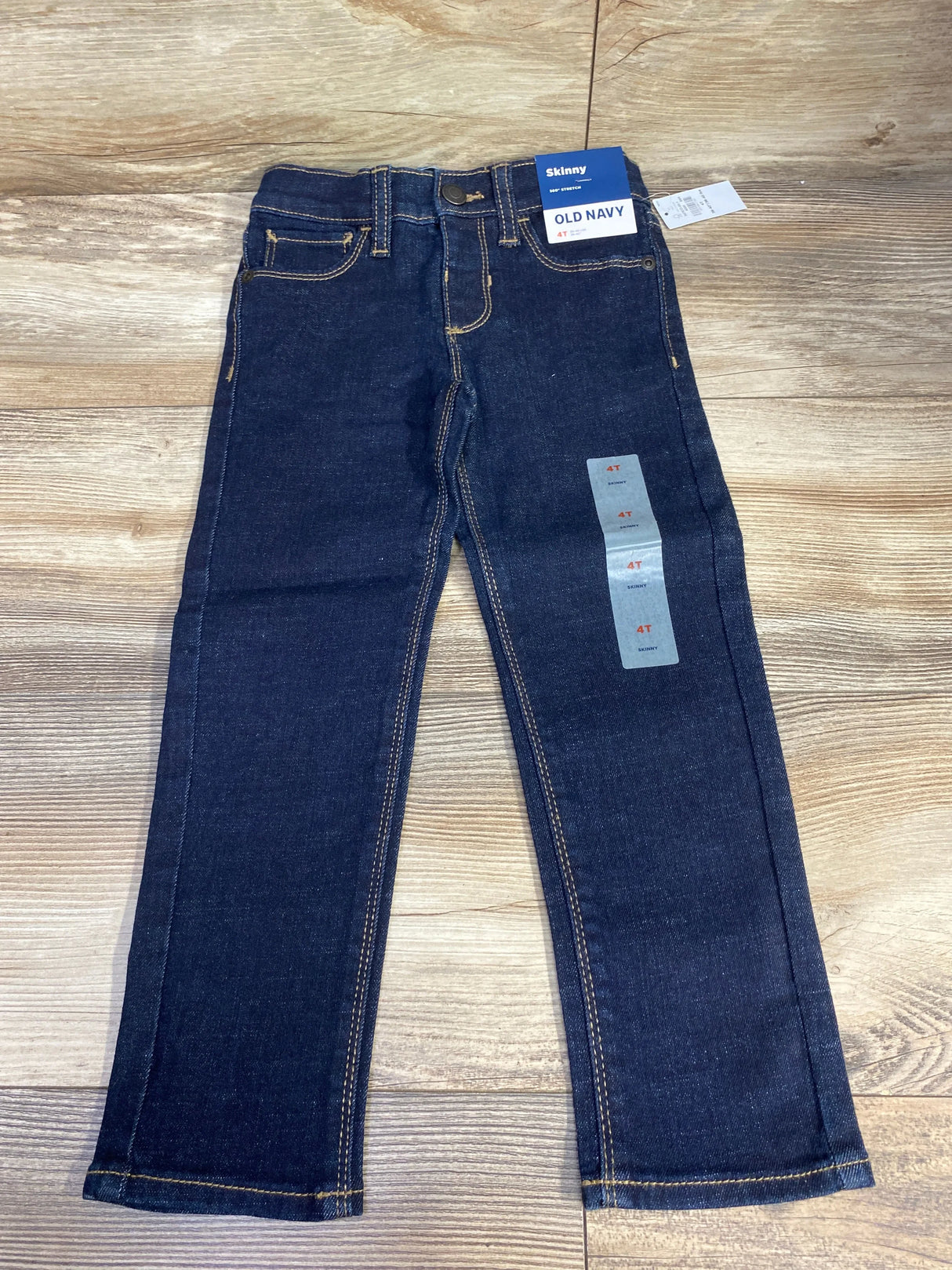 Old Navy skinny dark wash toddler jeans 4T, kids denim pants on wood background