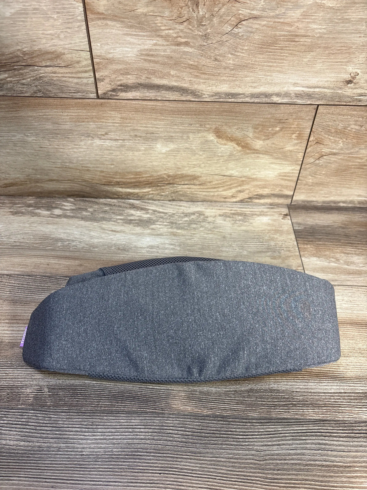 Front view of the Frida Mom C Section Recovery Band in grey showcasing its wide support panel on a wood-look floor