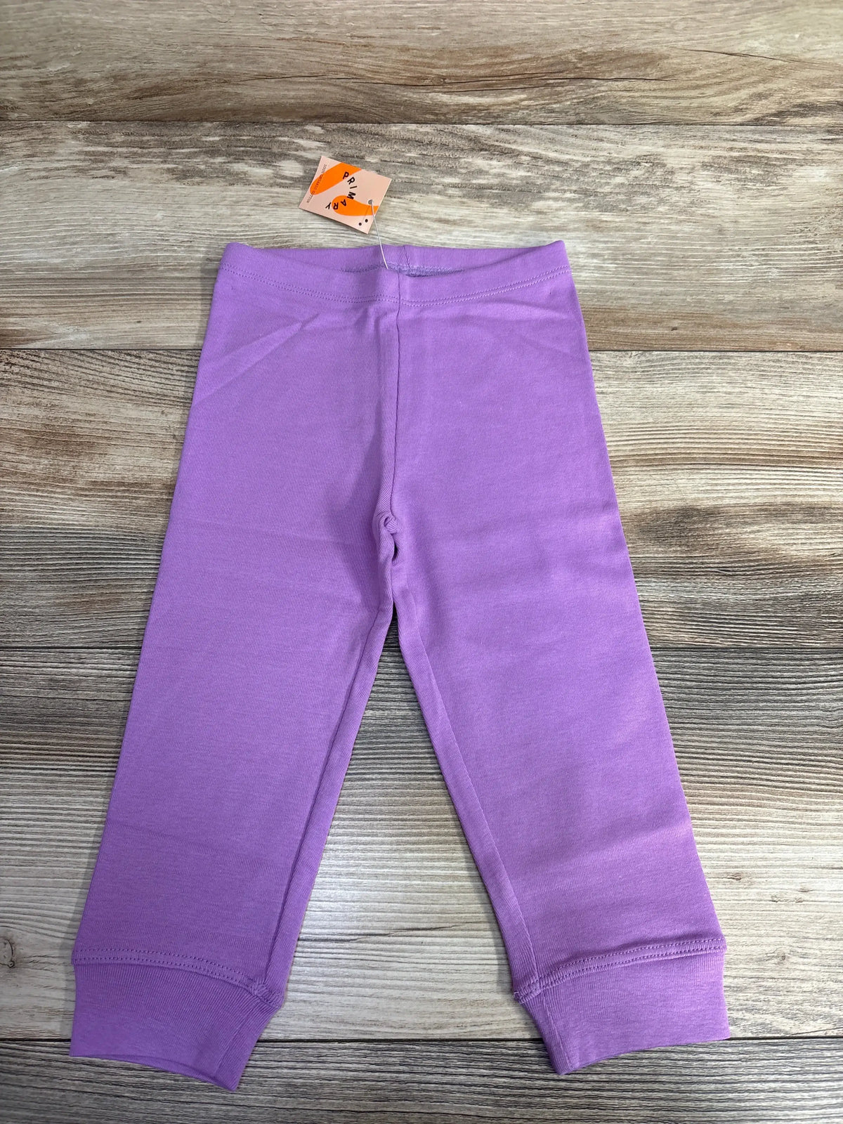 Kids lilac purple cotton leggings with cuffs on wood background, new with tags