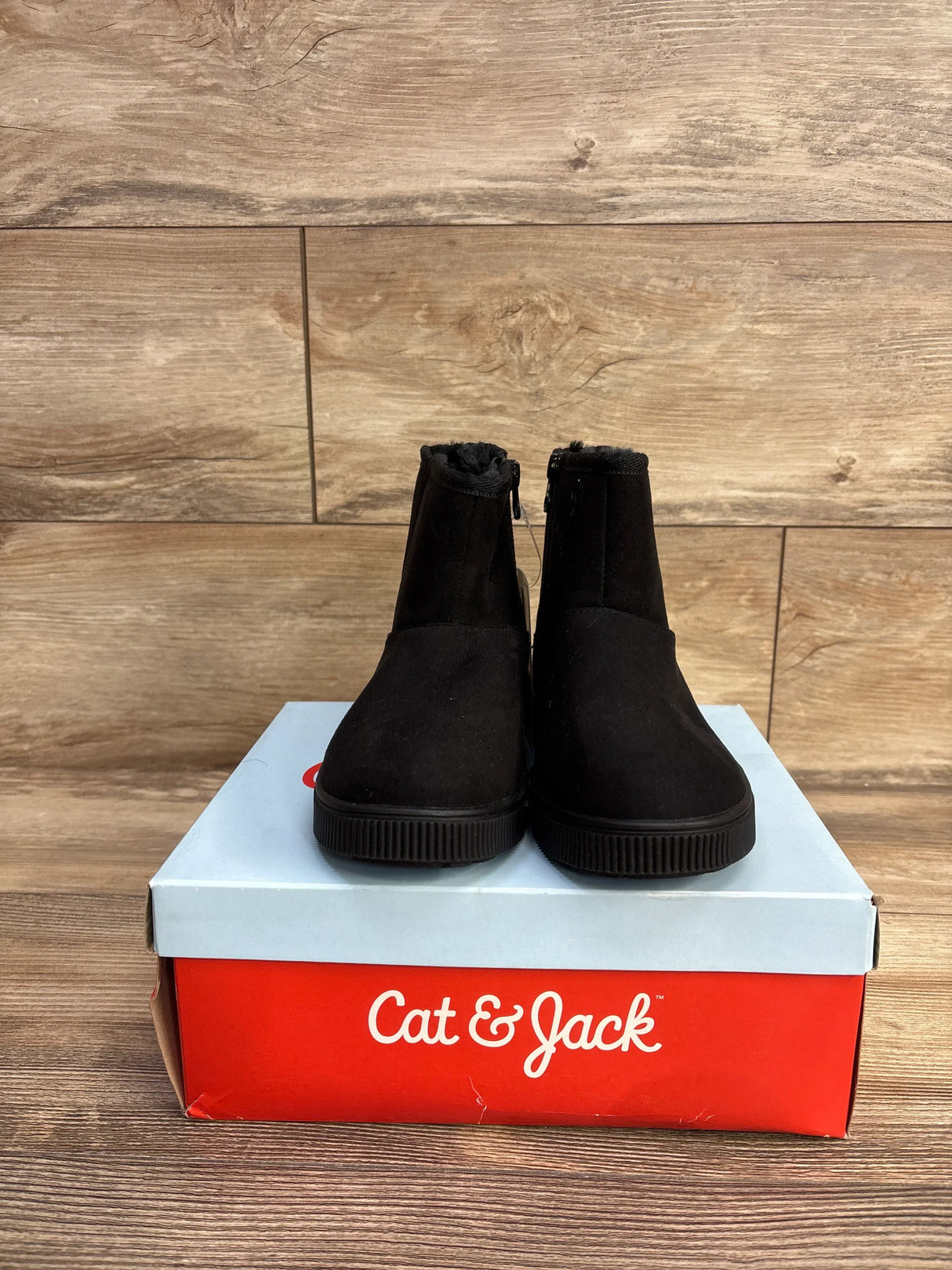 Front view of Cat & Jack Holland Shearling Style black kids ankle boots size 1Y showing faux fur lining and side zipper on shoebox