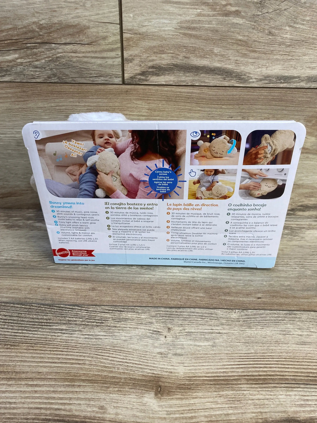 Back of Fisher-Price Soothe & Settle Bunny box showcasing product photos and Calms baby’s senses badge on wood floor