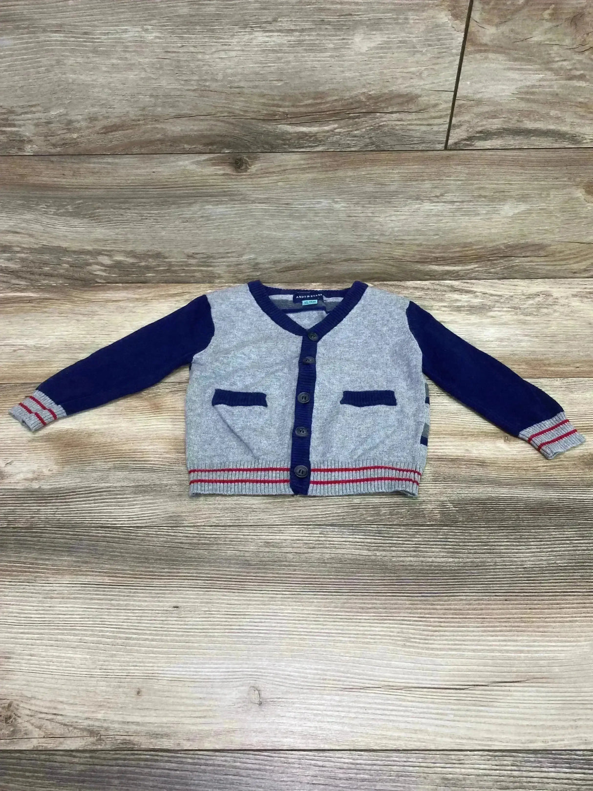 Front view of Andy & Evan toddler cardigan in navy and grey showing button closure and ribbed cuffs on white background