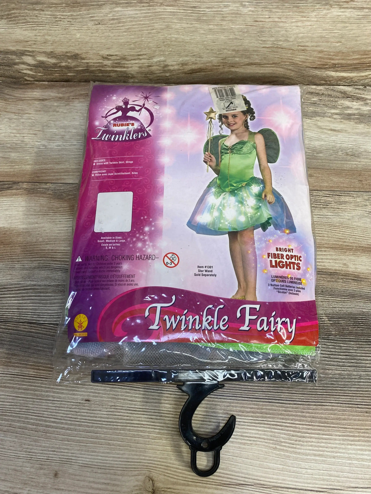 Front view of Rubie’s Twinklers Twinkle Fairy costume, size 8-10, in packaging showing a green fiber optic dress and wings