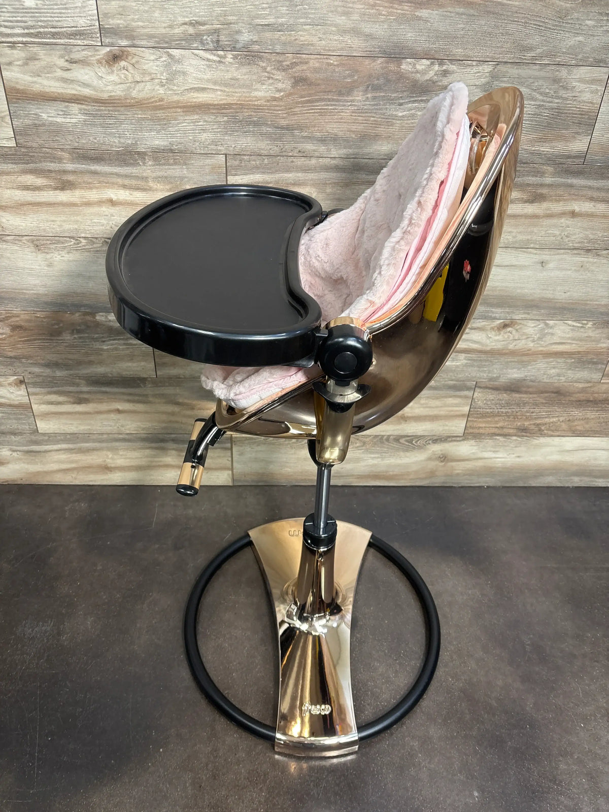 Three-quarter view of Bloom Fresco Special Edition high chair showcasing rose gold frame, black tray, and pink padded seat