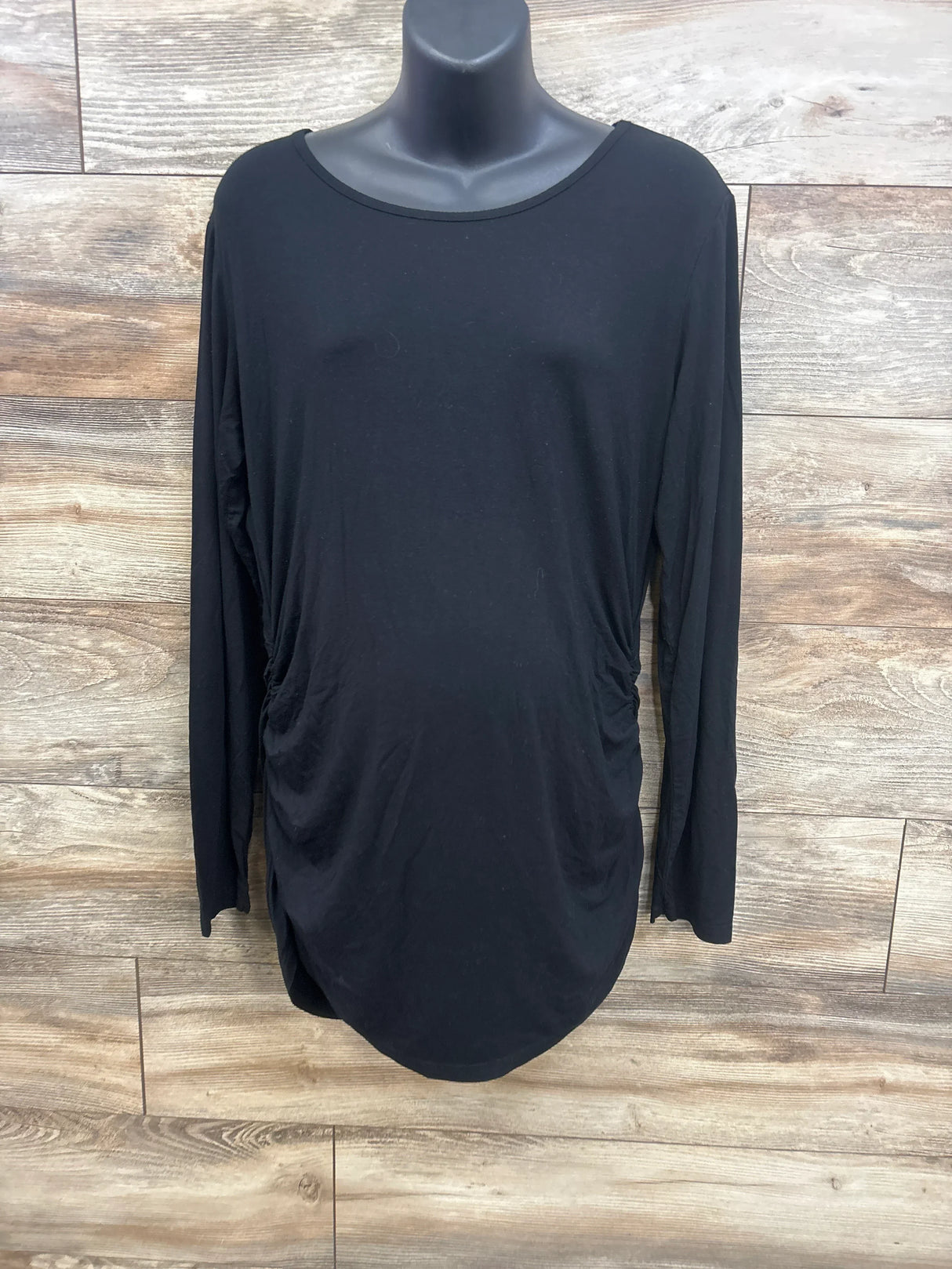 Black long sleeve maternity top with side ruching, displayed on mannequin for kids & maternity resale