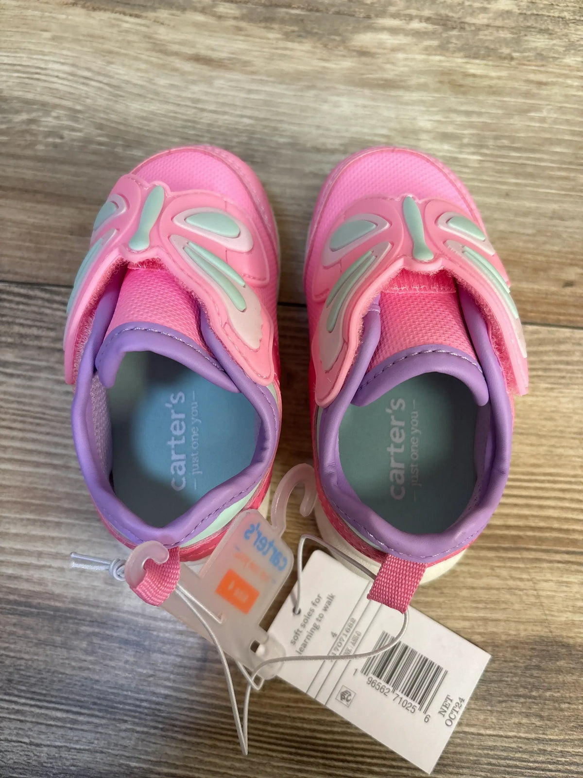 Pink and purple toddler shoes with butterfly design on wood floor, Carter's brand, new with tags