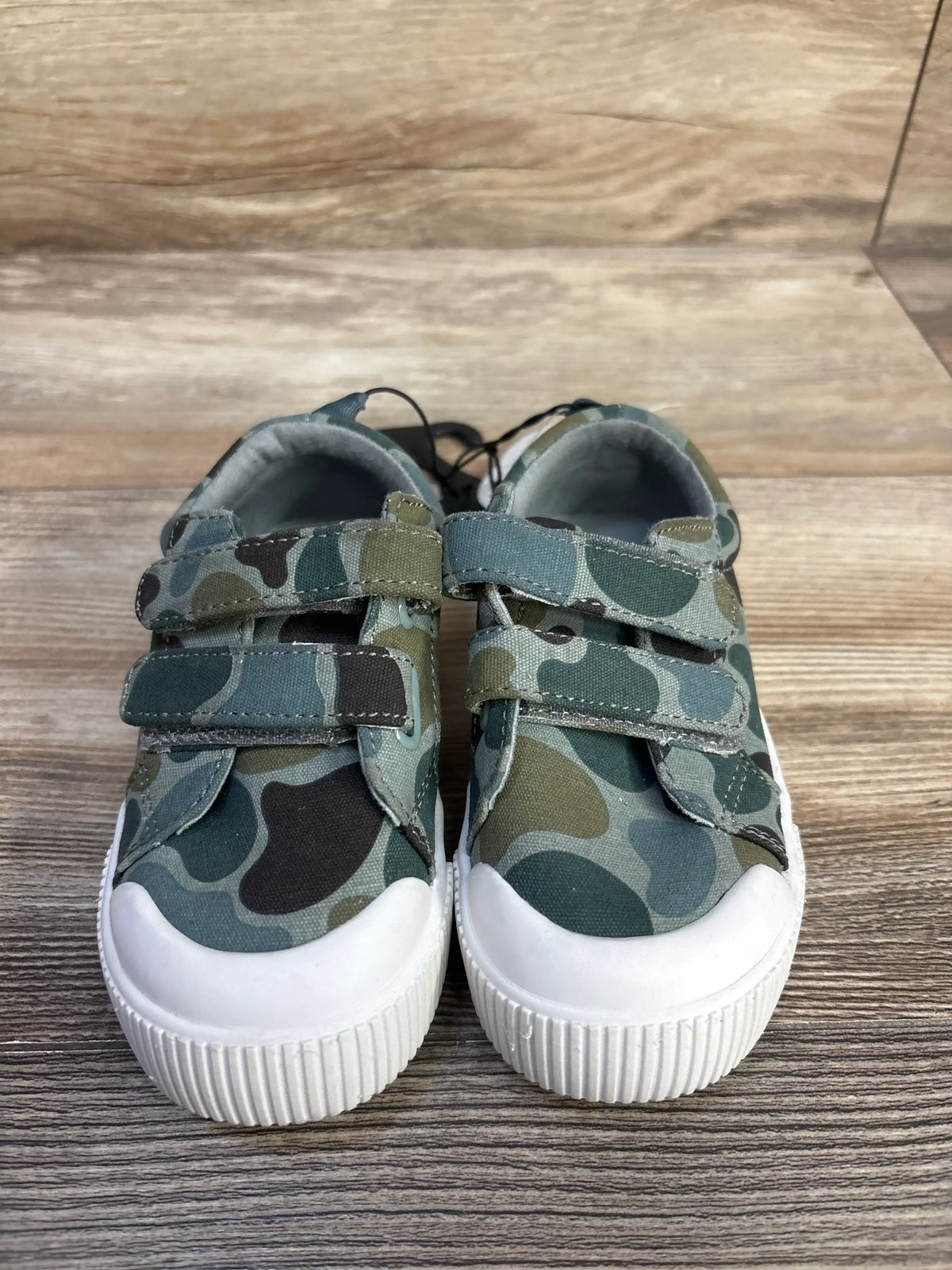 Front view of Wonder Nation green sneakers, size 7C, with camouflage print, double hook-and-loop straps, and white bump toes