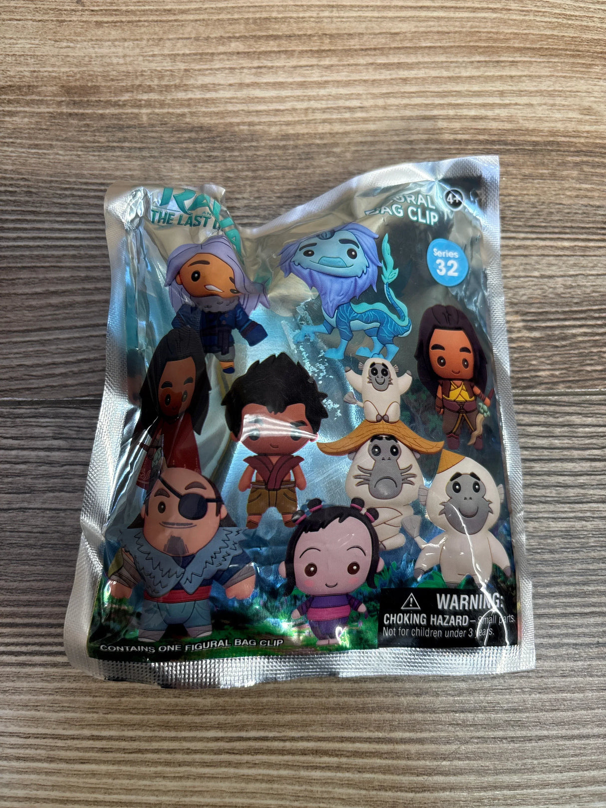 Raya and the Last Dragon figural bag clip Series 32 blind bag on wood surface