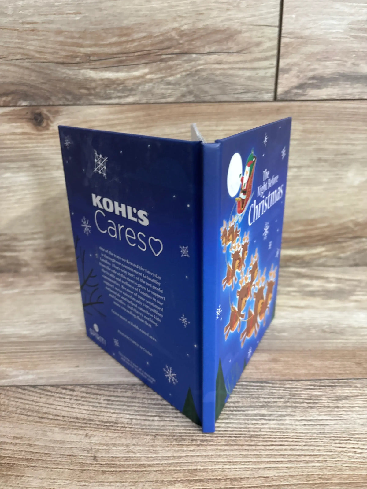 The Night Before Christmas children's book with Santa and reindeer on blue cover, Kohl's Careso edition