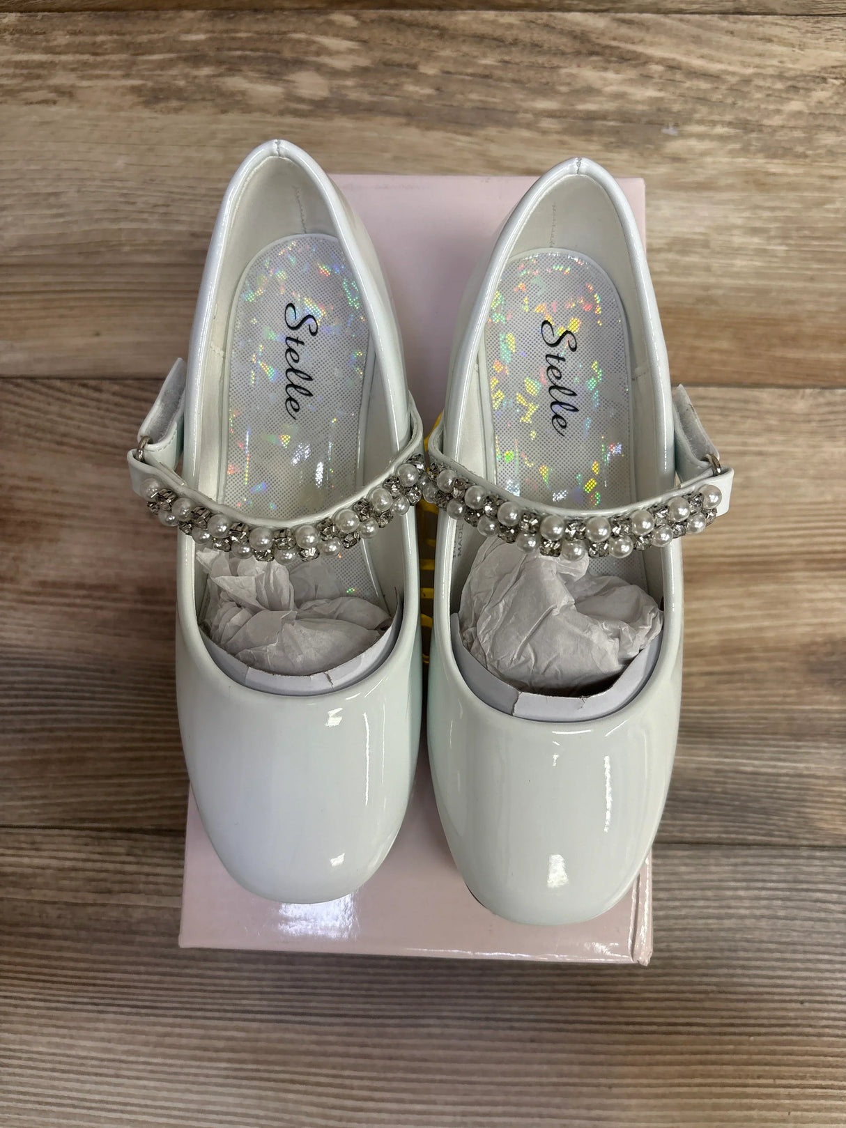 White patent leather girls' dress shoes with pearl and rhinestone strap, on pink box, kids footwear