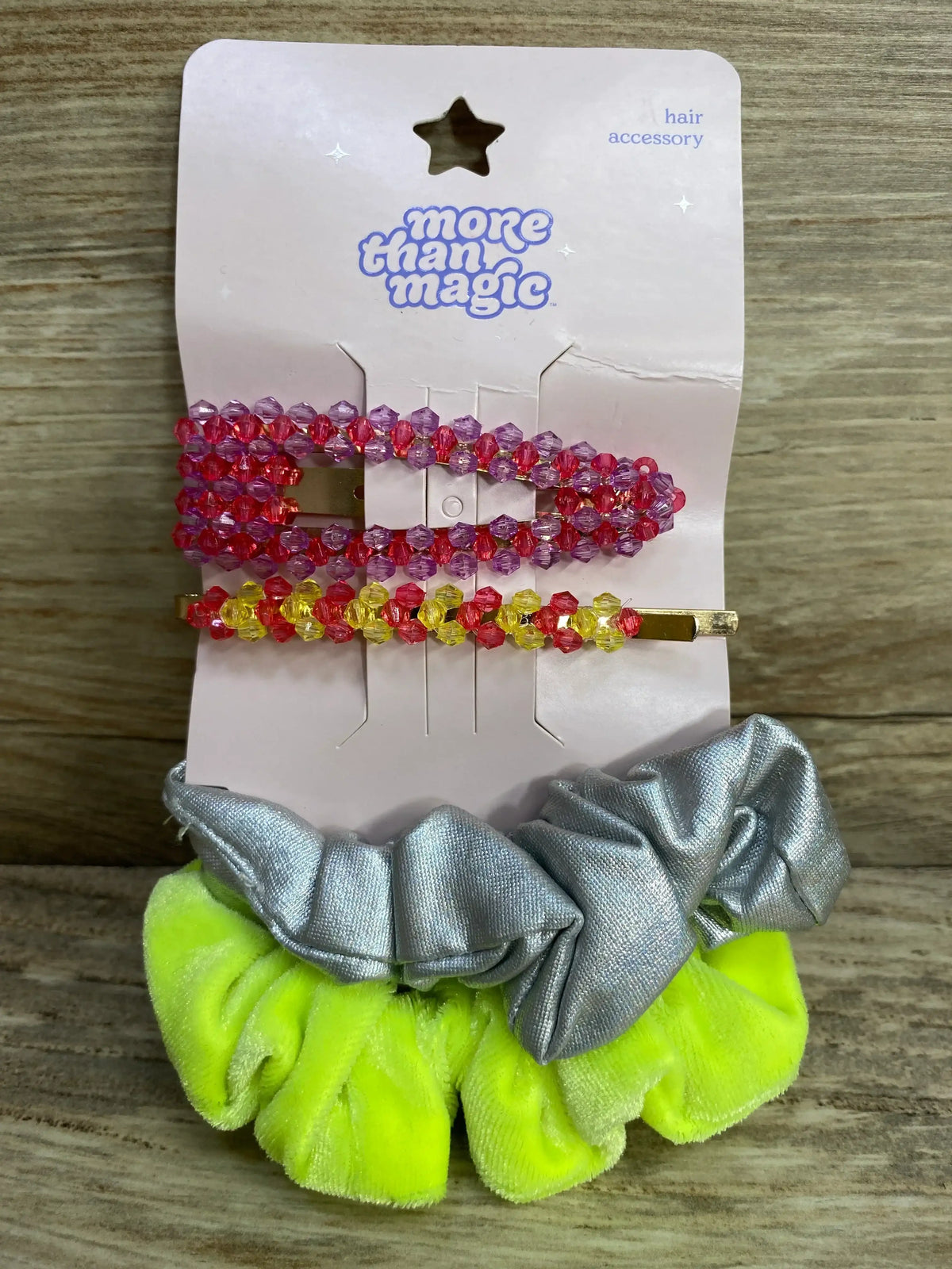 Front of More Than Magic hair accessories 4-pack showing pink and yellow beaded clips and neon green and silver scrunchies
