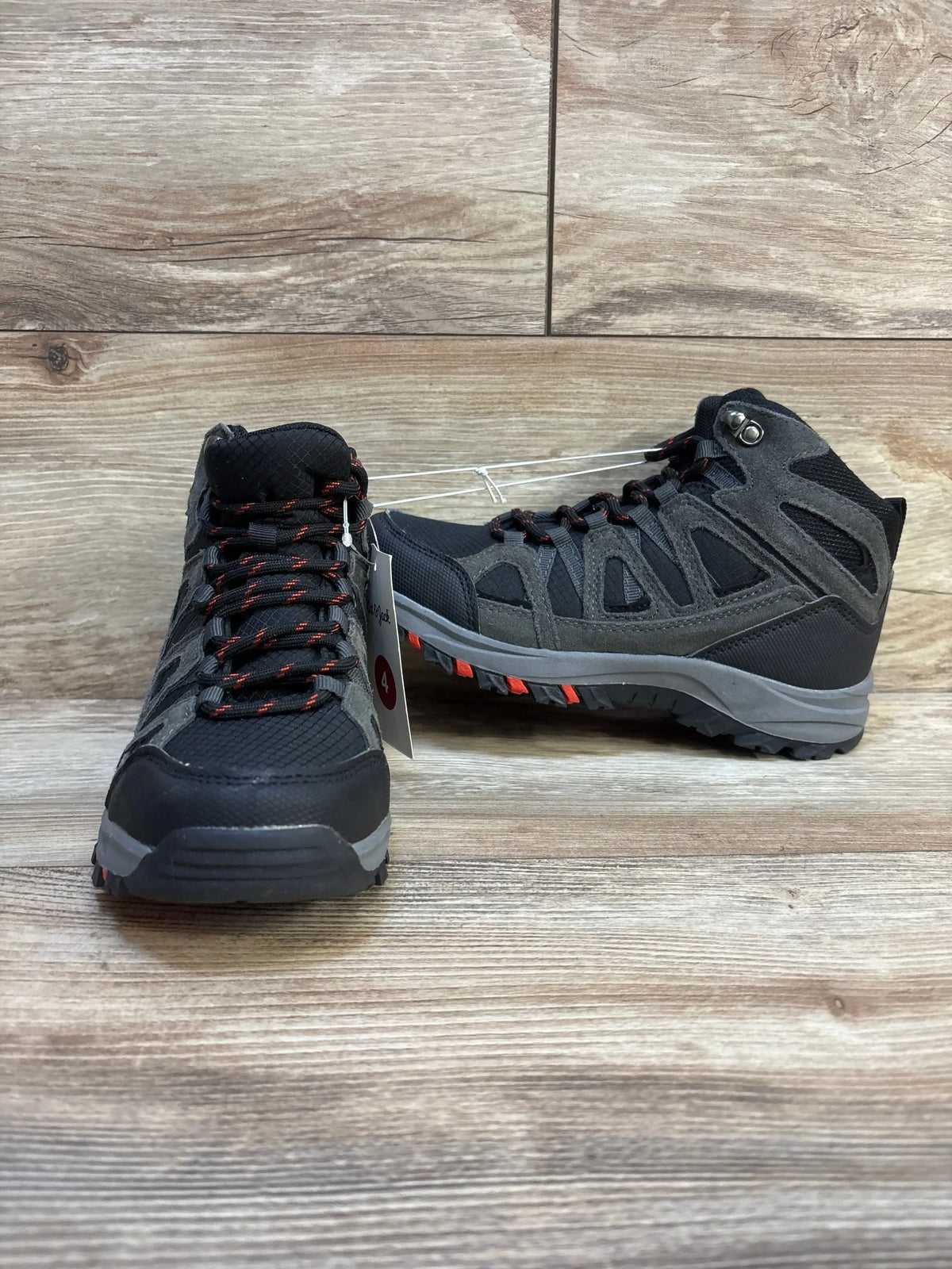 Angled view of Cat and Jack Patsy kids’ hiking boots size 4Y showing gray and black upper, red laces and rugged tread