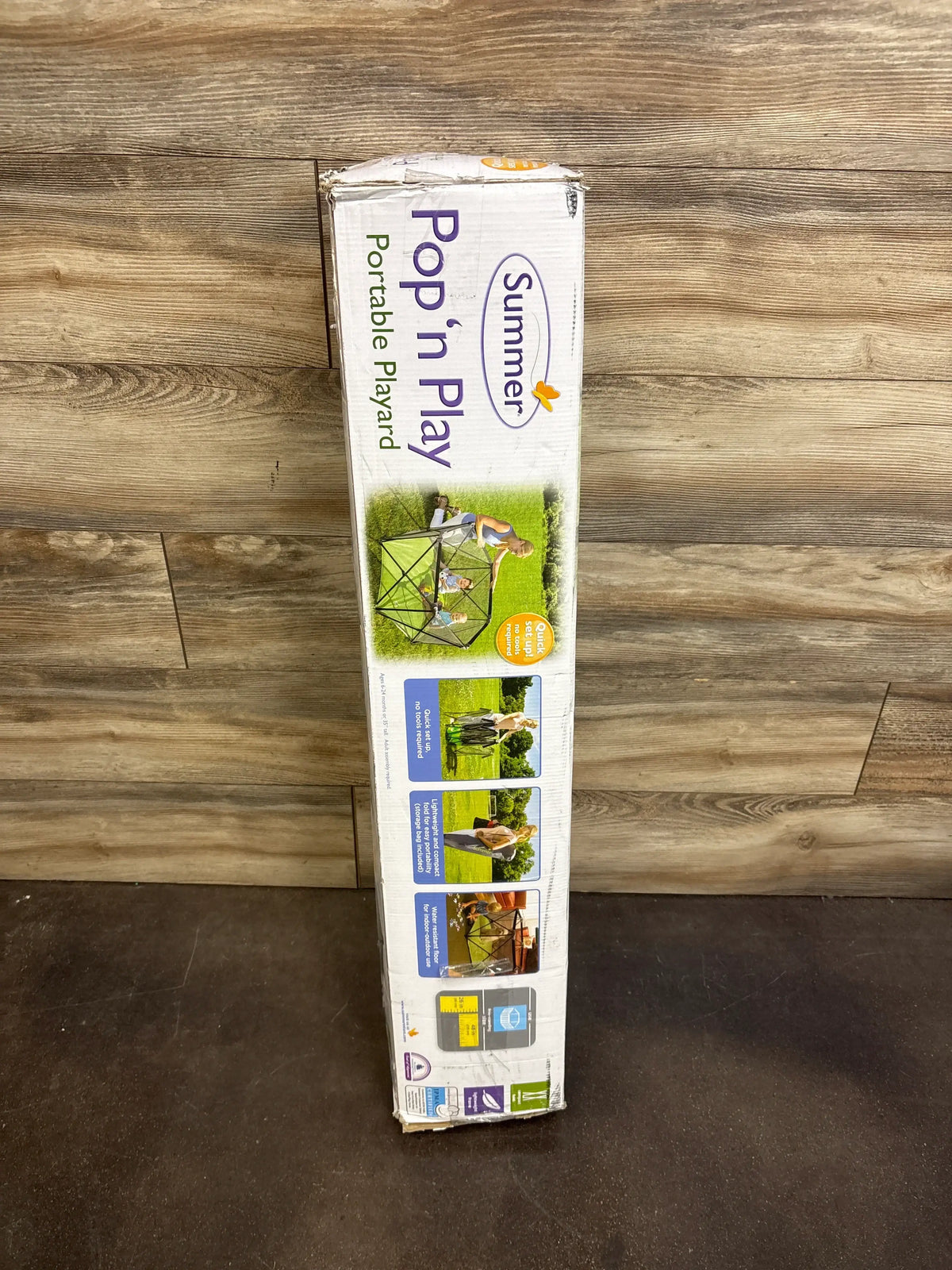 Boxed Bright Starts Pop ’n Play indoor/outdoor playard showing portable setup scenes on a wood floor