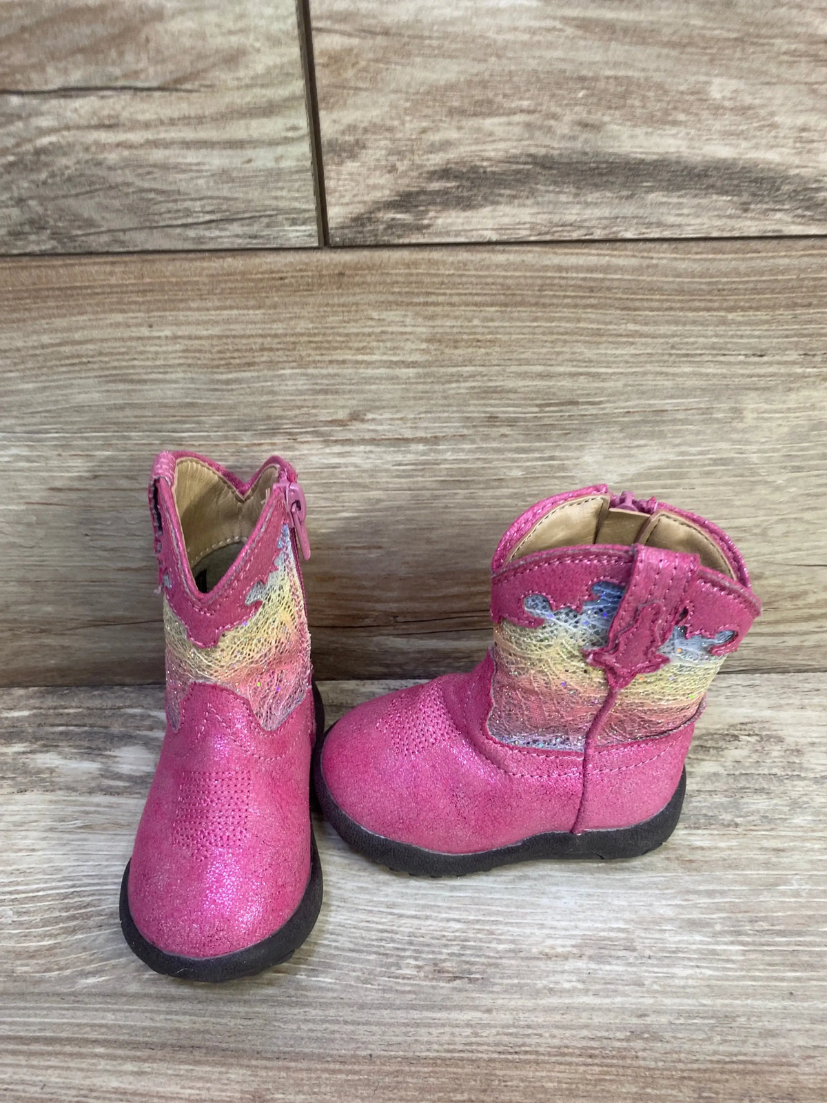 Front and side view of Roper infant glitter Cowbabies boots showcasing pink round toes and western stitching