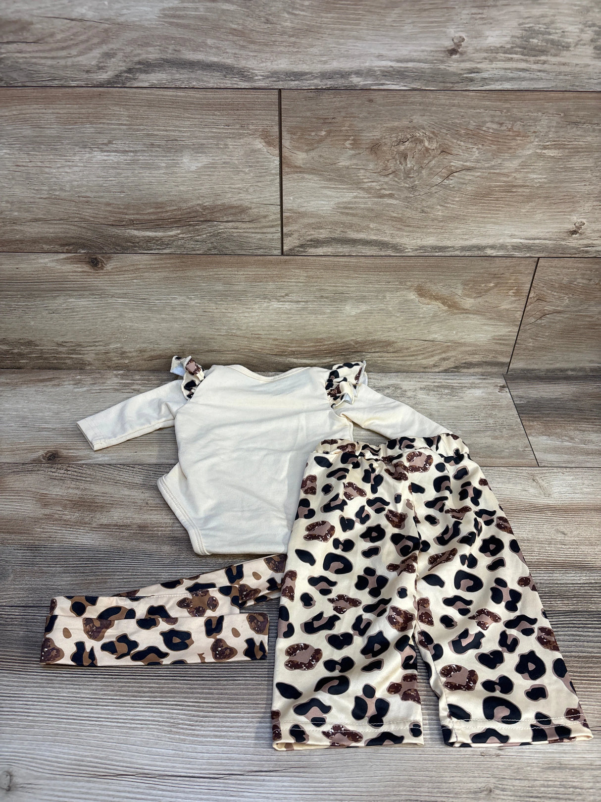 Baby cream long sleeve bodysuit with ruffle shoulders and leopard print pants set