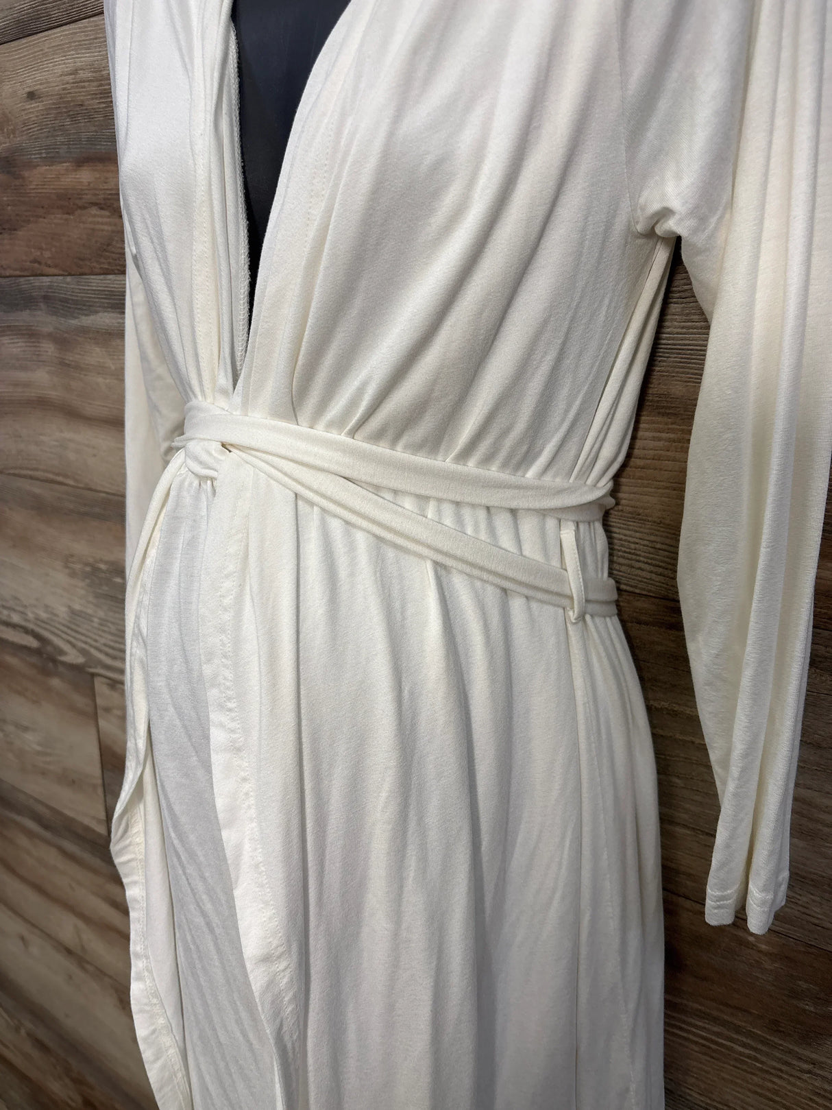 Ivory maternity robe with sash tie, long sleeves, and soft knit fabric on mannequin