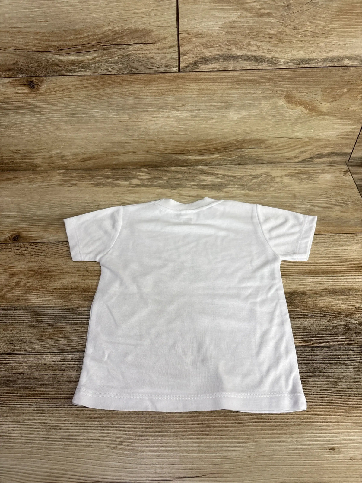 White kids t-shirt on wood floor, plain short sleeve top for children's clothing resale