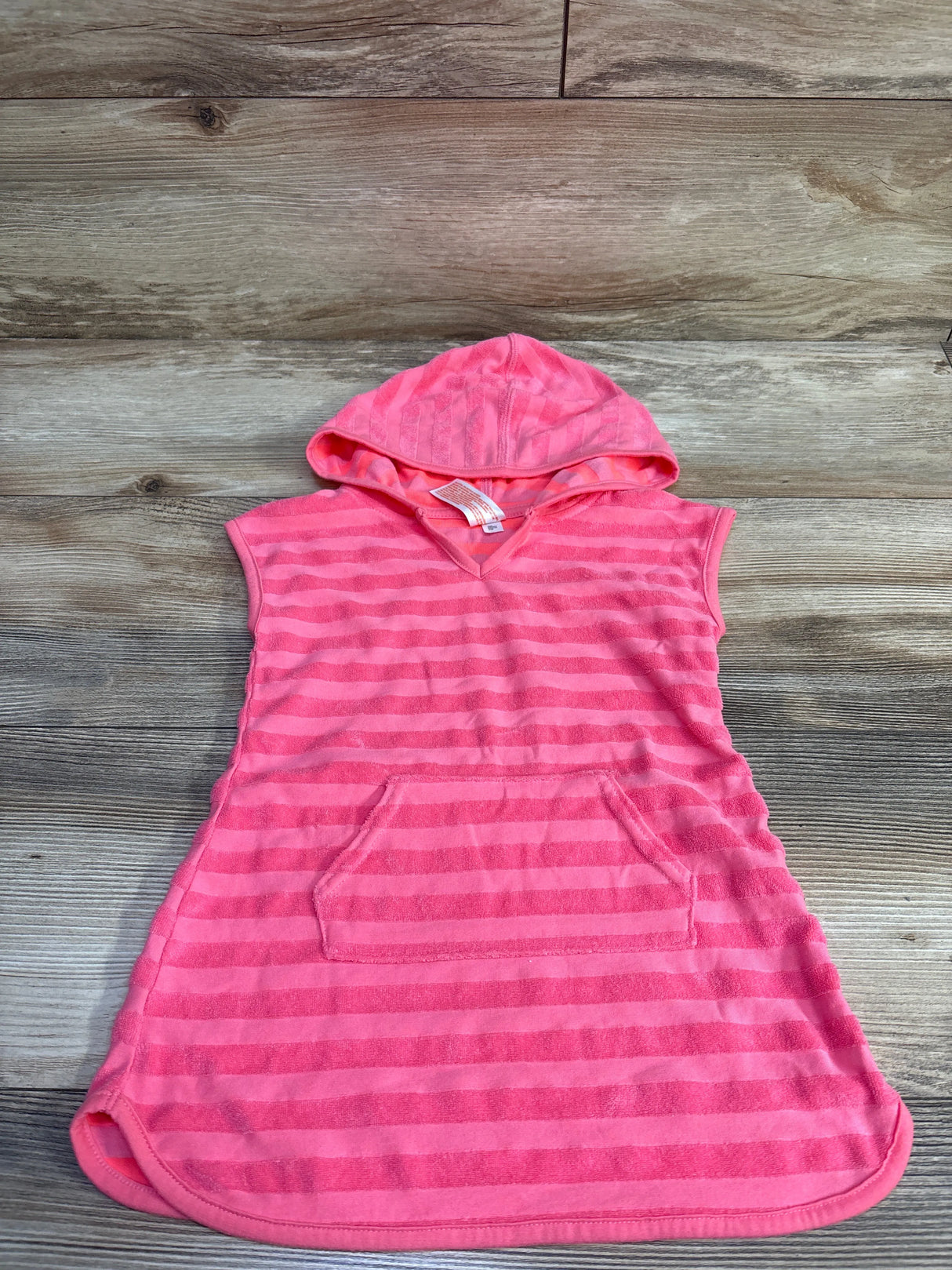 Flat lay of pink striped hooded terry swim cover-up with front pocket on wood background, size 2T