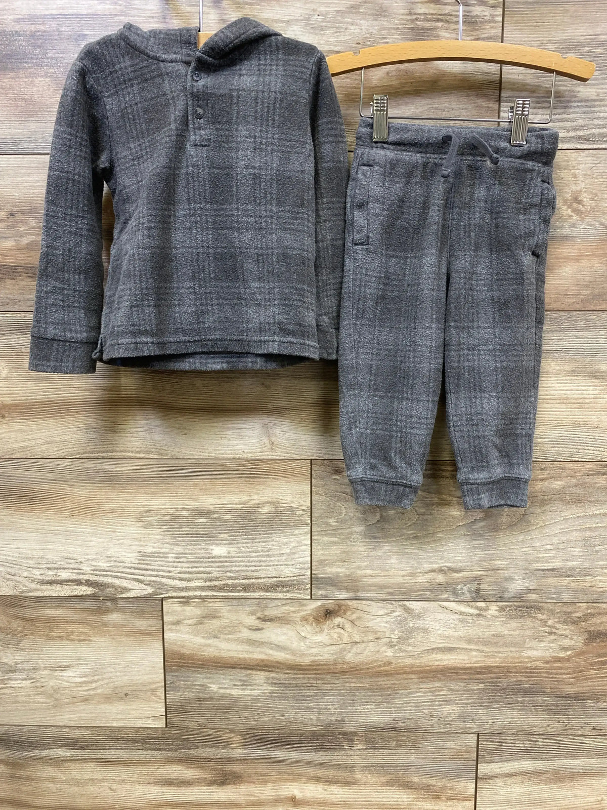 Gray plaid toddler hoodie and jogger pants set on wooden background