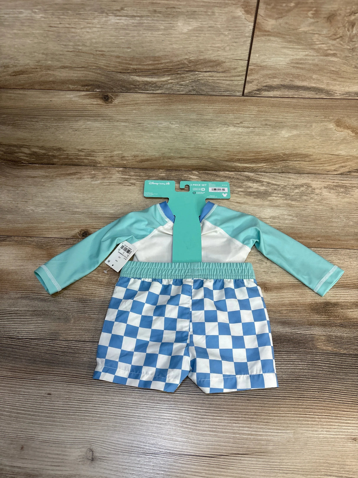 Disney baby 2-piece swim set with blue checkered shorts and long-sleeve rash guard