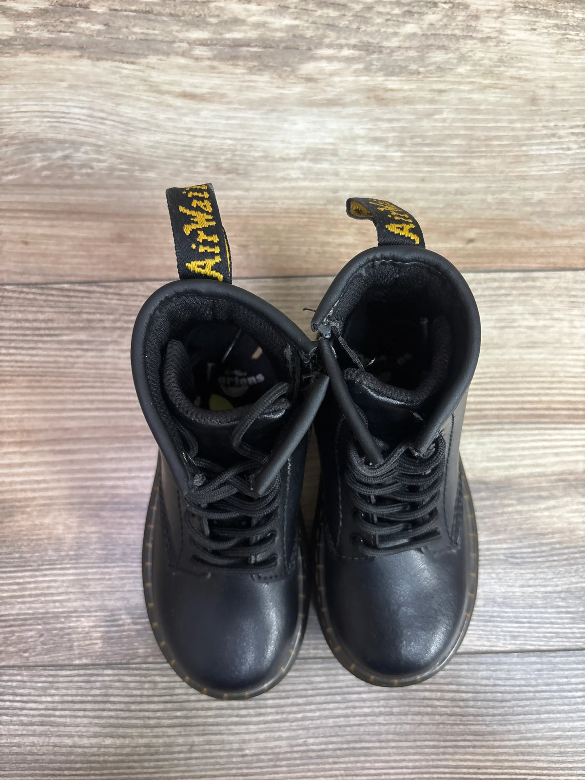 Front view of black leather Me n Mommy To Be children's boots with black laces.