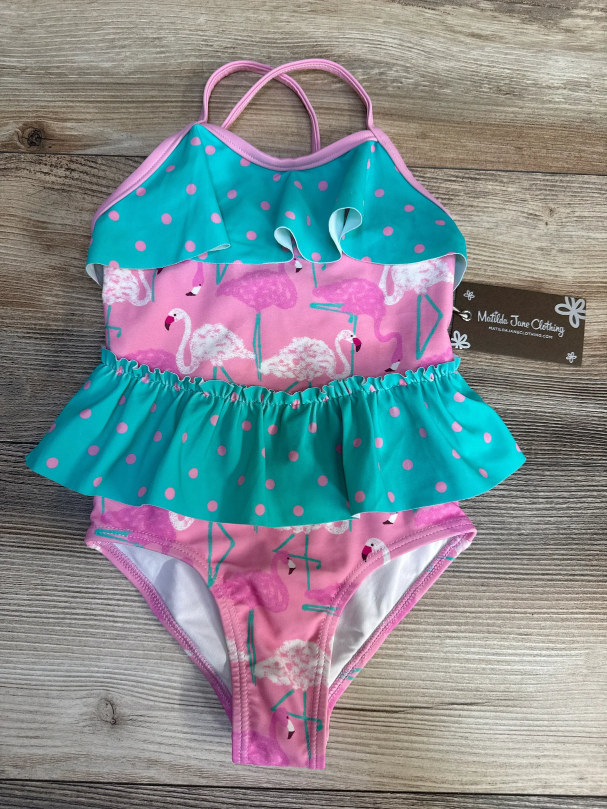 Pink and teal ruffled girls one-piece swimsuit with flamingo and polka dot pattern