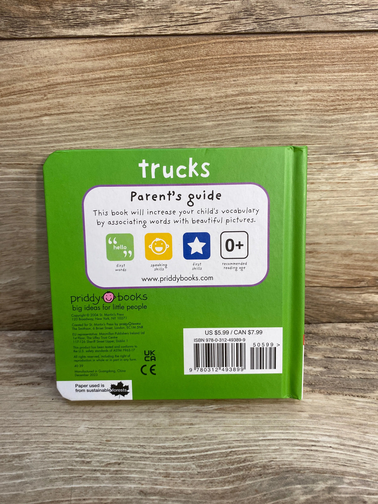Back cover of green children's board book titled Trucks with parent's guide and price $5.99 US