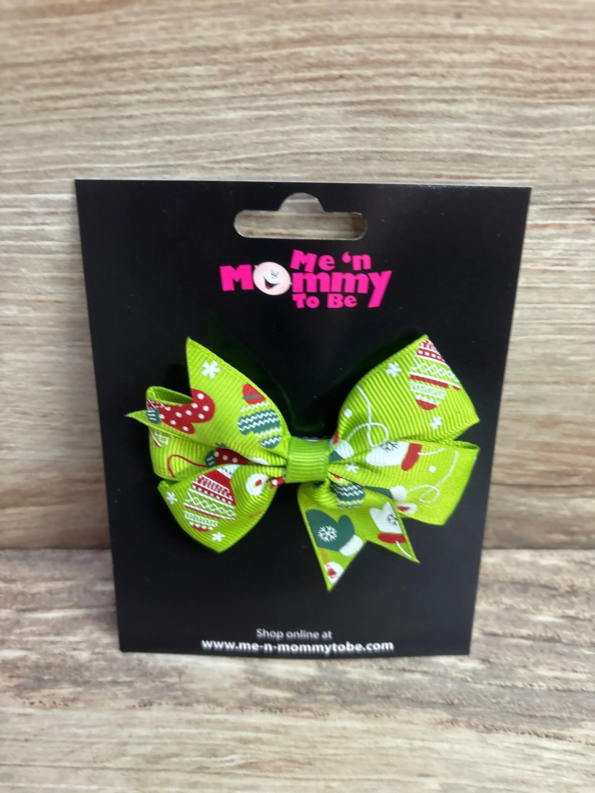 Green holiday-themed hair bow with festive patterns for kids, perfect for Christmas outfits.