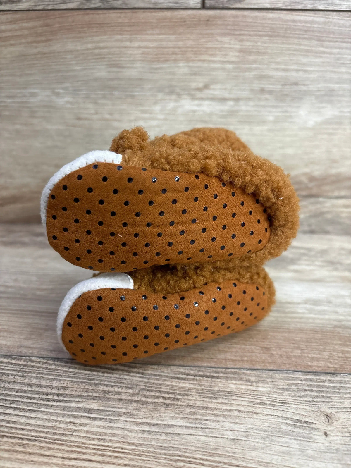 Brown baby booties with black polka dots and white trim, soft sole for infants