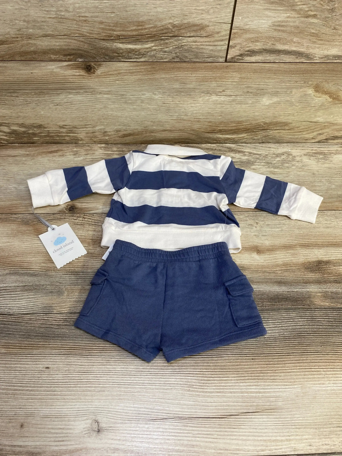 Front view of blue Cloud Island newborn polo and shorts set showing fox graphic on polo and striped shorts on white backdrop