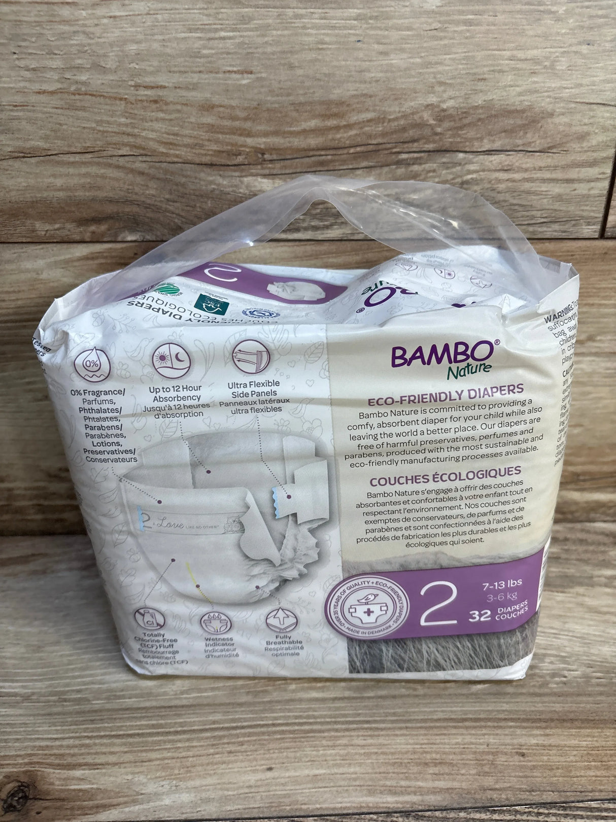 Bambo Nature eco-friendly diapers, size 2, 32 count, for 7-13 lbs, fragrance-free & breathable, on wood surface