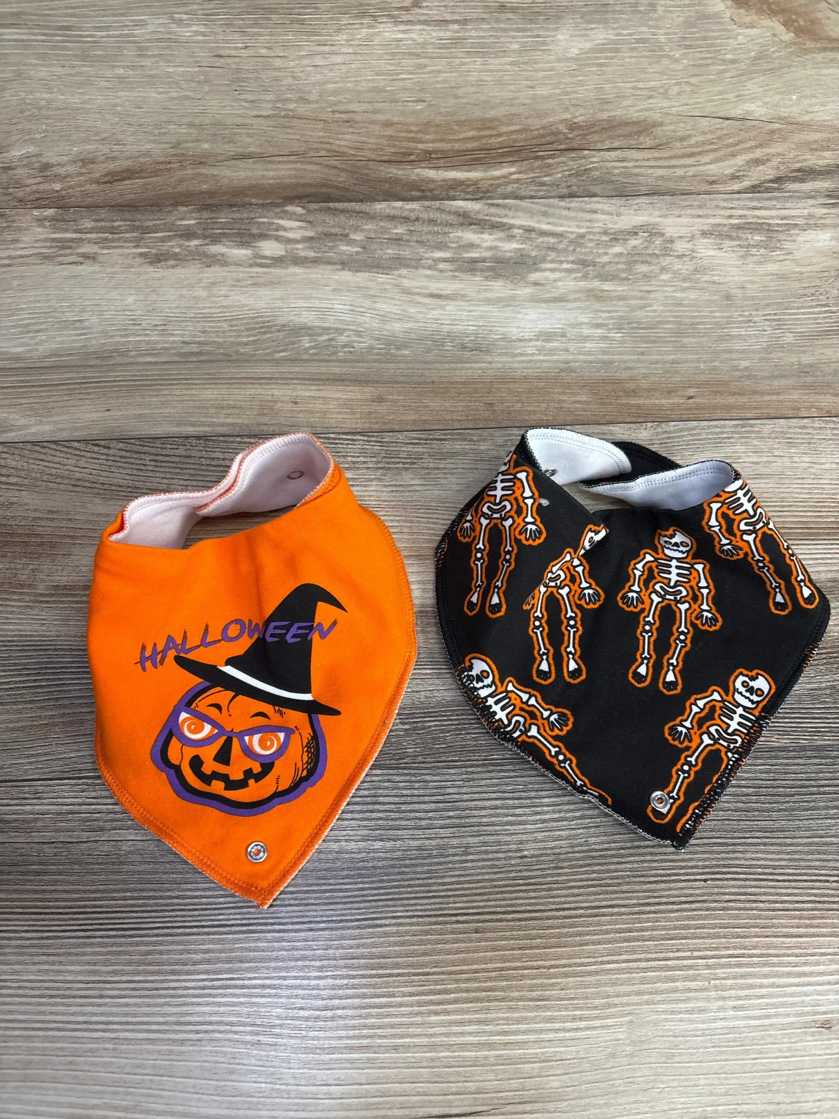 Halloween baby bibs: orange pumpkin witch and black skeleton designs for kids, perfect for festive baby gear.
