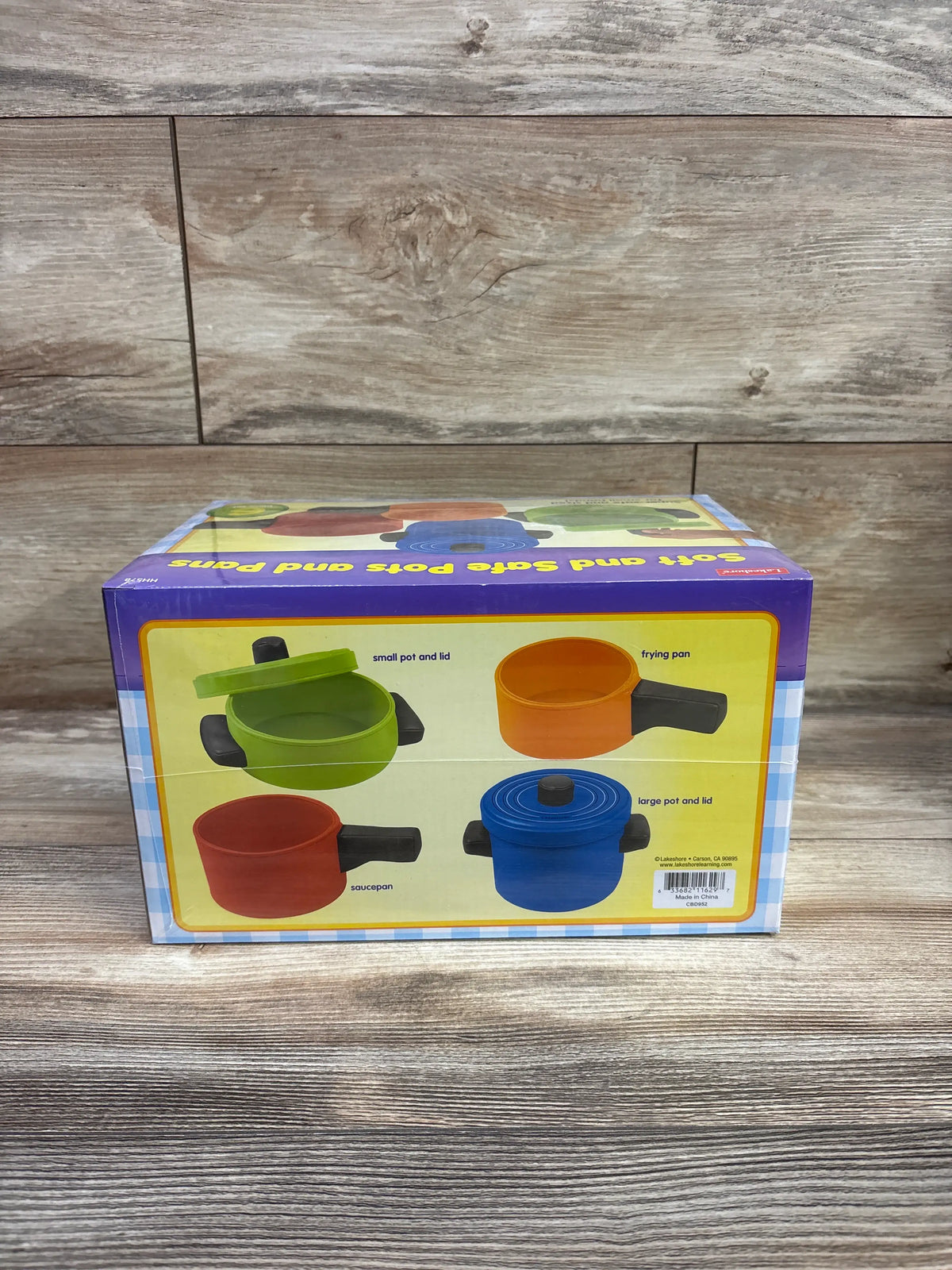 Back of Lakeshore Soft and Safe Pots and Pans box showing colorful small and large pots with lids, a frying pan, and saucepan