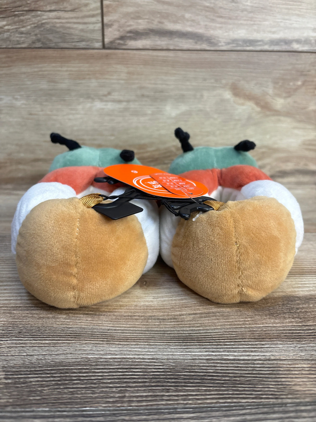 Adorable pumpkin-themed baby shoes with plush design, perfect for infants and toddlers. Soft, cozy, and festive for fall.