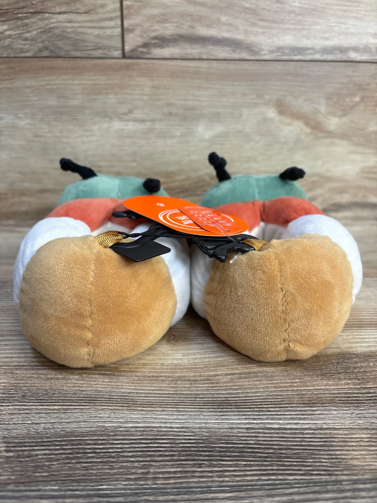 Adorable pumpkin-themed baby shoes with plush design, perfect for infants and toddlers. Soft, cozy, and festive for fall.