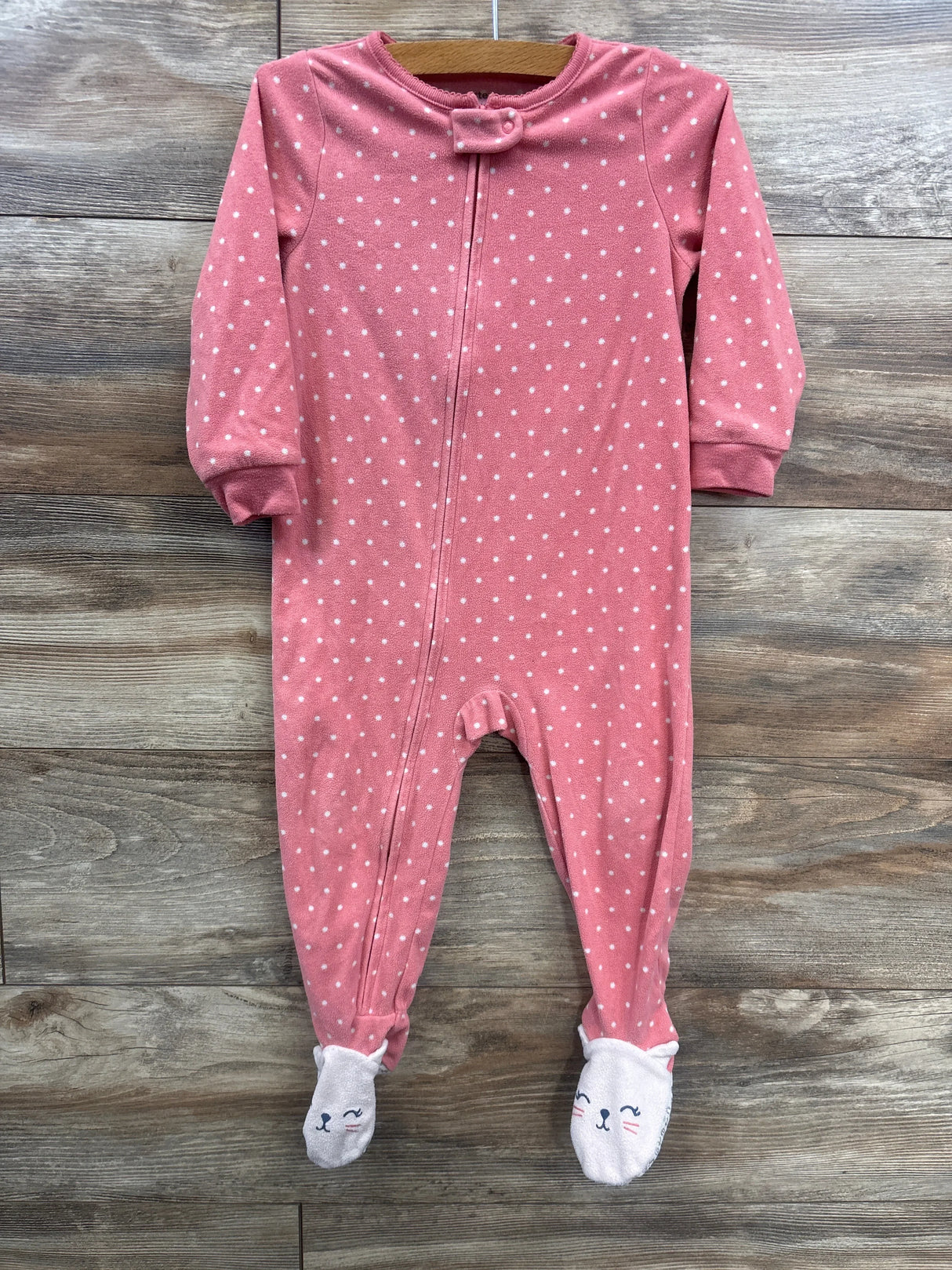 Pink polka dot baby sleeper with animal face footies, long sleeves, and front zipper