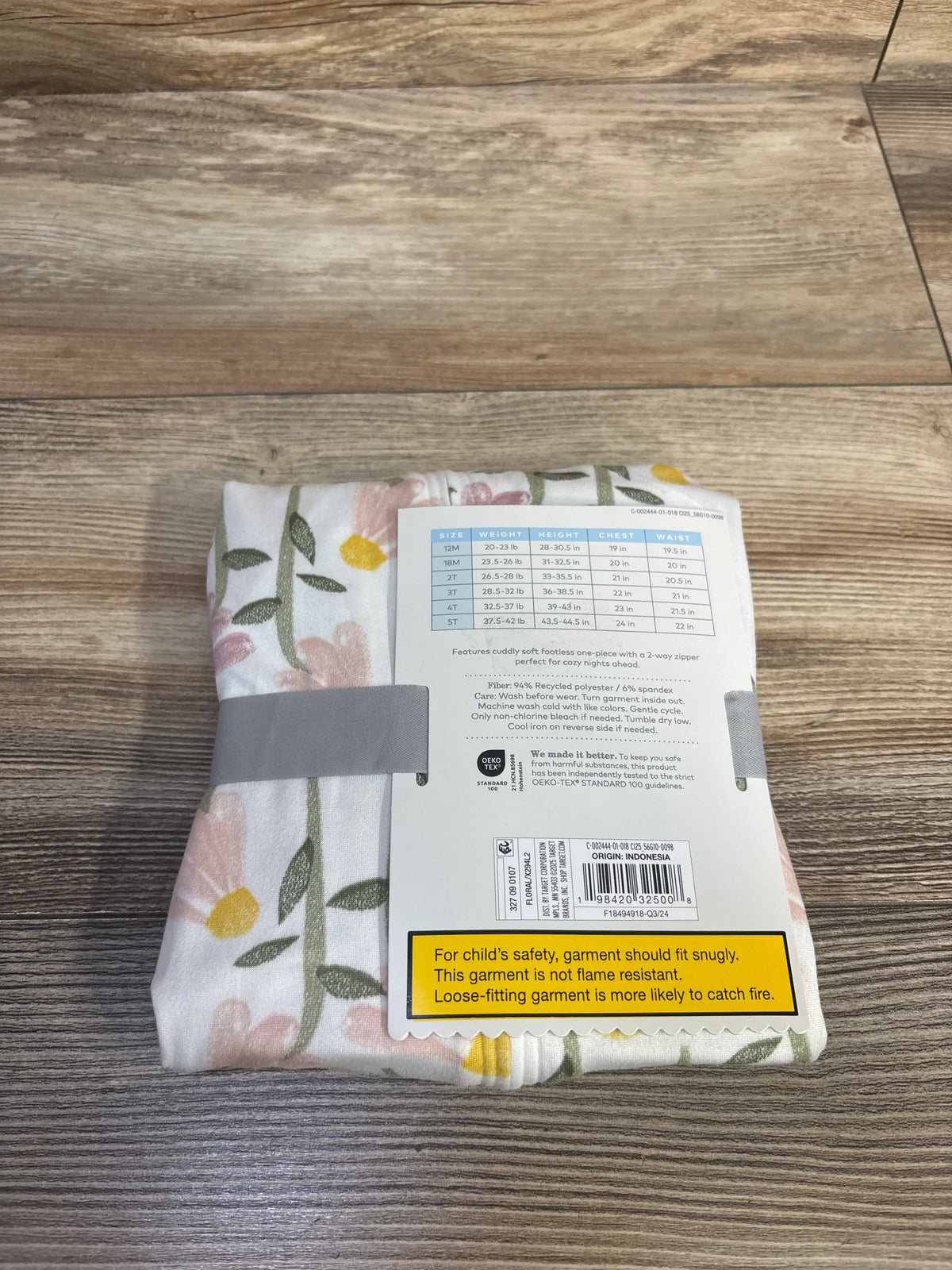 Cloud Island floral white footless sleeper for toddlers showing size chart and tags
