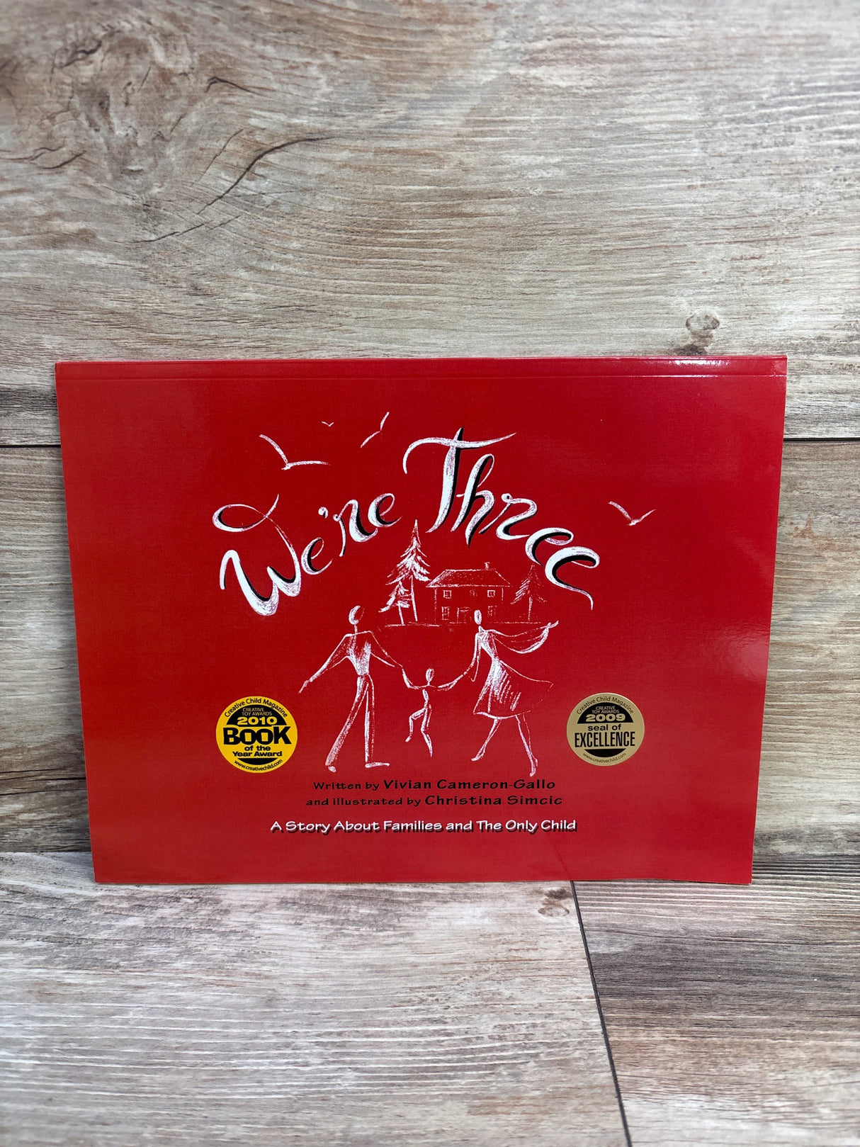 We're Three: A Story About Families and The Only Child Paperback Book