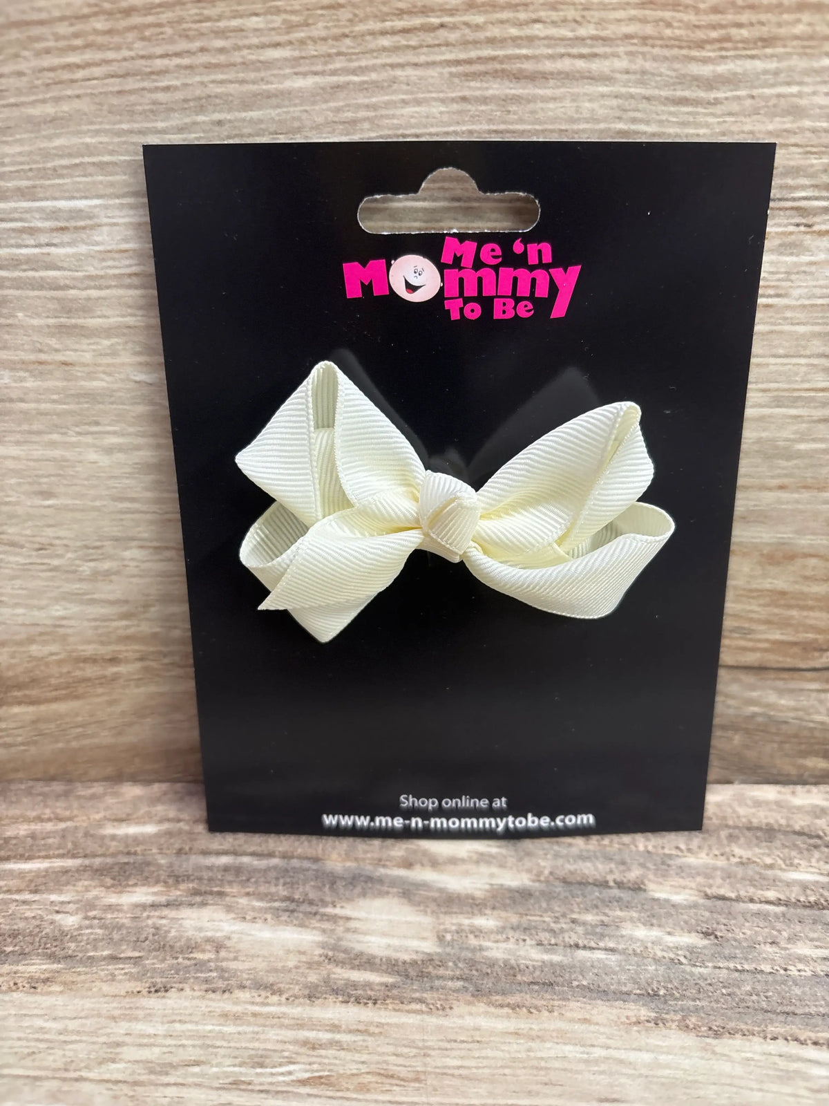 Front view of NEW Solid Hair Bow Ivory showcasing layered loops and center knot on a black display card