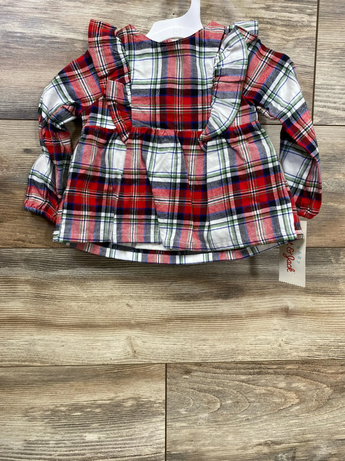 Red green plaid baby dress with ruffles, long sleeves, on hanger for kids clothing resale