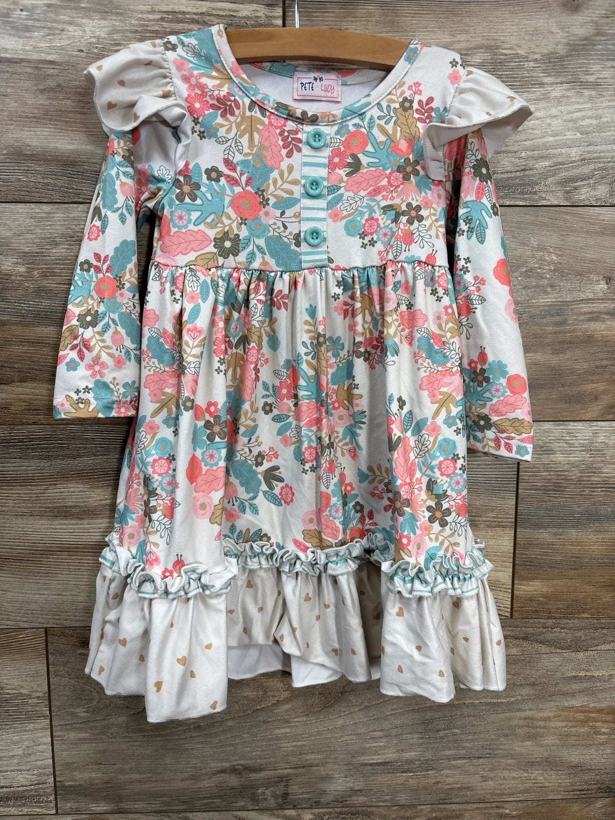 Girls long sleeve floral dress with pink, teal, and gold print, ruffled skirt and button front