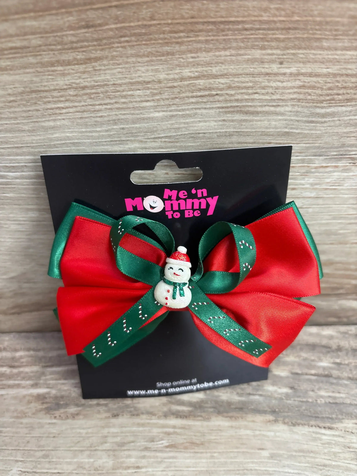 Red and green Christmas bow with snowman charm for kids, festive holiday hair accessory