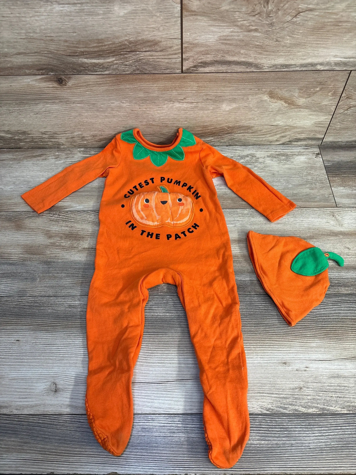 Orange pumpkin-themed baby onesie with matching hat, 'Cutest Pumpkin in the Patch' design