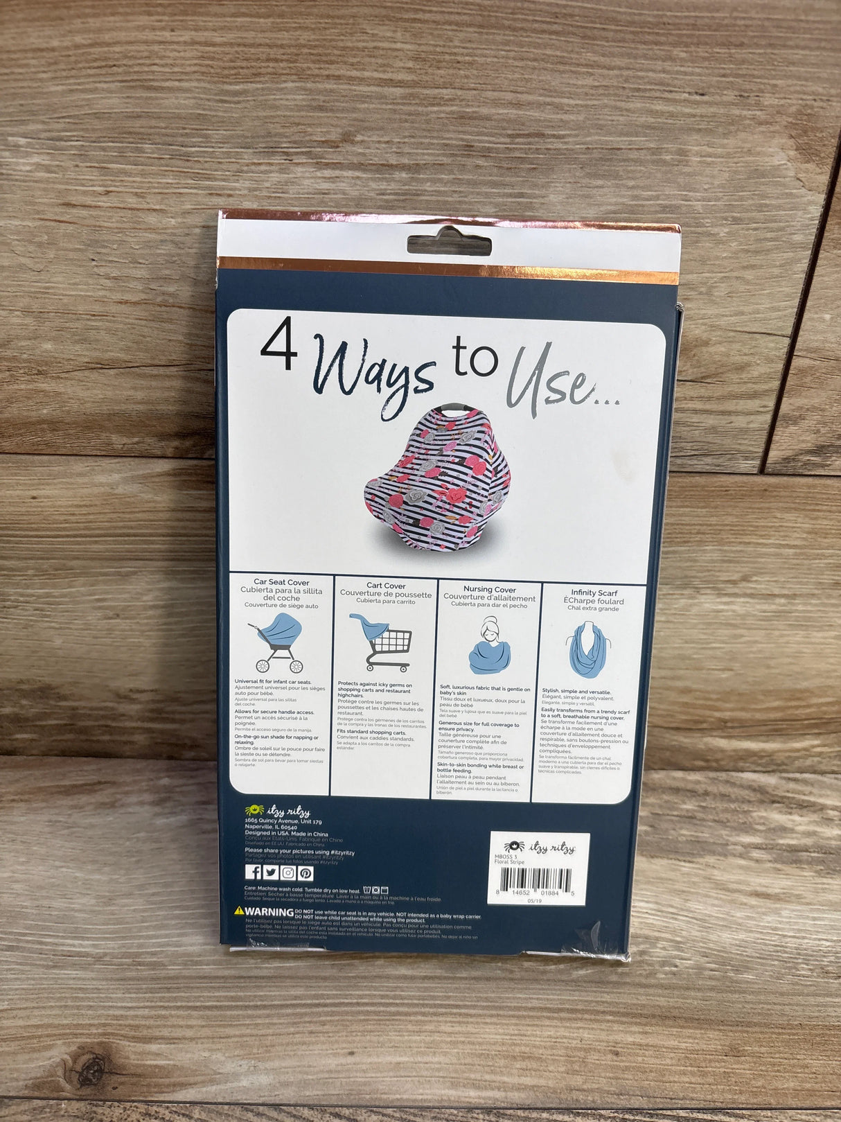 Packaging for multi-use baby cover, showing 4 ways to use: car seat, cart, nursing, scarf.