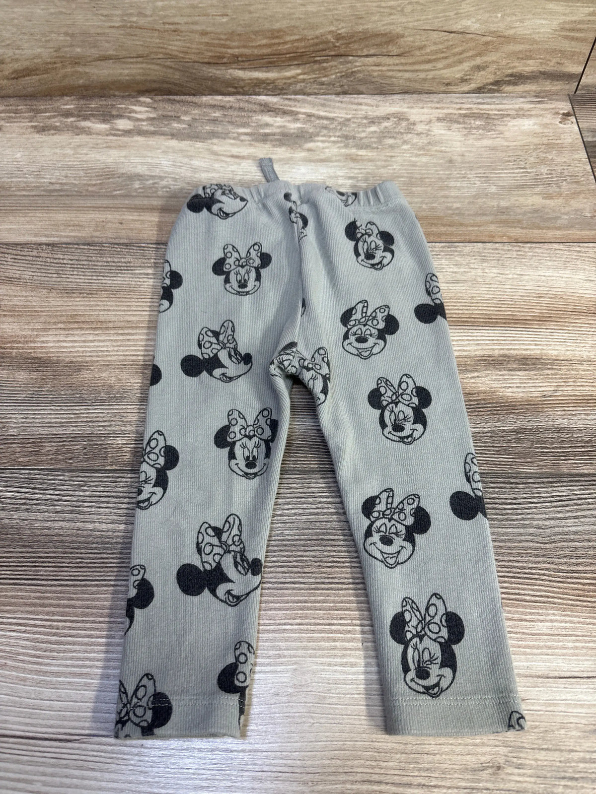 Front view of Zara x Disney Minnie Mouse ribbed leggings in sage, showing an elastic waistband and all-over Minnie Mouse print